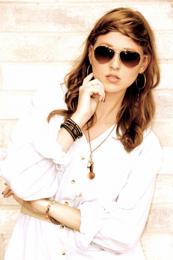 model with aviator sunglasses and braided crown
